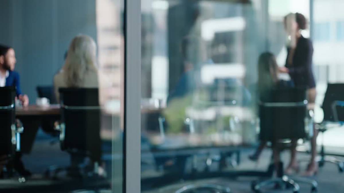 Executives in a cyber risk workshop aligning fraud and ransomware priorities and board‑level reporting for 2026.